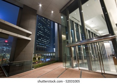 Entrance Of A Modern Building At Night In Hong Kong