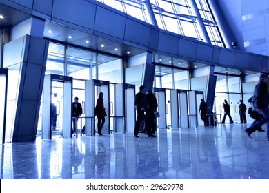 Entrance To Modern Building And People Silhouettes