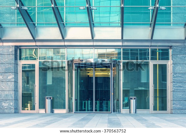 Entrance of\
the modern business city office\
building.