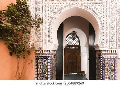 Entrance to Mosque, Intricate Moroccan beautiful Archway with Wooden Door and traditional decorative colorful tiles, Marrakesh, Marrakech, Morocco - Powered by Shutterstock