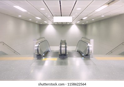 Entrance Of Moving Escalator In Modern Building To A Subway Station With No People, Selective Focus