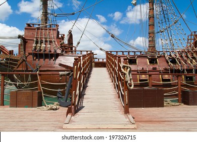 Entrance Of Pirate Ship In Park On Cloudy Background.