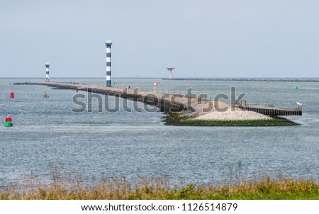 The entrance of the Port of Rotterdam in the Netherlands with dams and lighthouses,  seen from the Landtong near Rozenburg.