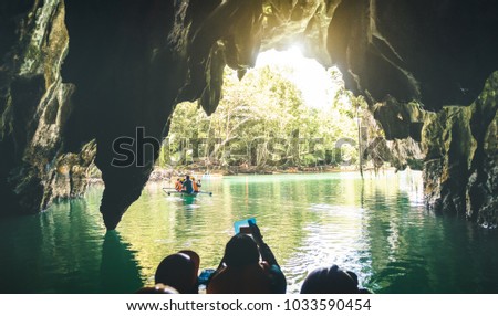 Entrance of Puerto Princesa Palawan subterranean underground river - Adventurous exclusive Philippines destinations seven nature wonders - Contrast back lighting filter with point of view composition