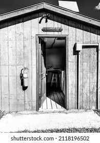 Entrance To A Rural Campground Laundromat With A Washer And Dryer.