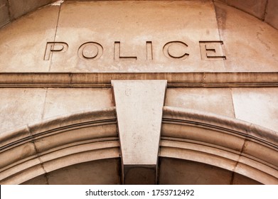 Entrance sign over an historic police station in London.  
