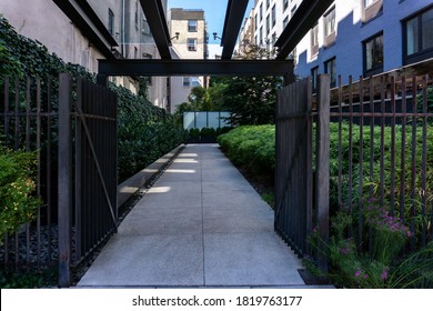 An Entrance Through Gate Into An Apartment Building In Manhattan, NYC