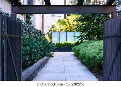 An Entrance Through Gate Into An Apartment Building In Manhattan, NYC