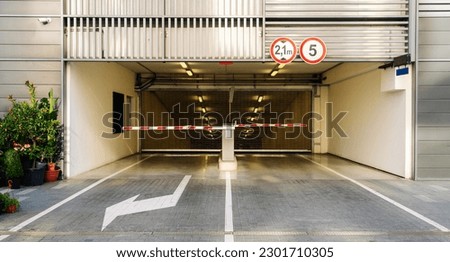Entrance to the underground parking and barrier