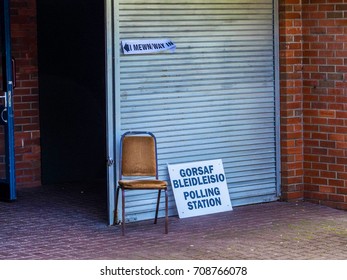 Entrance To A Welsh Polling Station On Election Day With Bilingual Signage Displayed Outside 