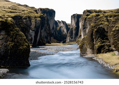 Entrance to a winding and mossy canyon. - Powered by Shutterstock