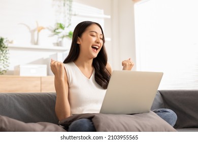 Entrepreneur of beautiful business asian young woman working online with laptop and celebrating at home with her work success cheerful and happiness. Small Business Startup concept - Shutterstock ID 2103955565