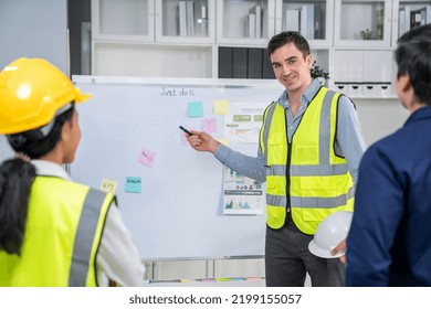 Entrepreneur Brainstorming Ideas With His Competent Engineers In The Office. Architectural Investors And Engineers Working On An Upcoming Project In A Fun And Friendly Environment.