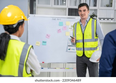 Entrepreneur Brainstorming Ideas With His Competent Engineers In The Office. Architectural Investors And Engineers Working On An Upcoming Project In A Fun And Friendly Environment.