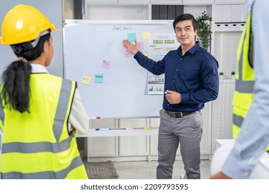 Entrepreneur Brainstorming Ideas With His Competent Engineers In The Office. Architectural Investors And Engineers Working On An Upcoming Project In A Fun And Friendly Environment.