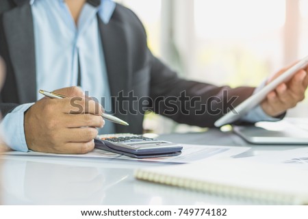 entrepreneur calculate financial cost. Businessman planning to extend business and calculating budget for develop and prepare to talk with bank to request financial loan.