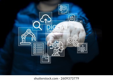 A Entrepreneur in a dark jacket points at a transparent digital interface featuring icons related to digital transformation, including cloud computing, AI, automation, analytics, and cybersecurity.