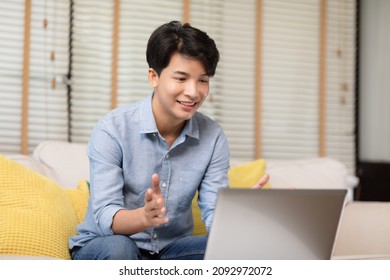 Entrepreneur Handsome Business Asian Man Wear Casual Blue Shirt Working Video Call Conference Online With Laptop,talking With Customer Or Business Team At Home Office.Small Business Startup Concept