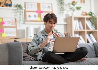 Entrepreneur Handsome Business Asian Man Wear Casual Blue Shirt Working Video Call Conference Online With Laptop,talking With Customer Or Business Team At Home Office.Small Business Startup Concept