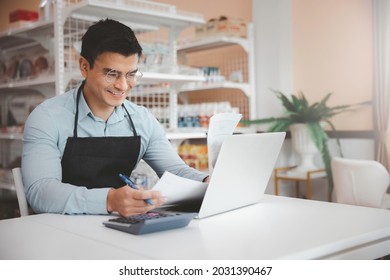 Entrepreneur Male Business Owner In Eyeglasses Using Computer Laptop Working In Grocery Shop Store