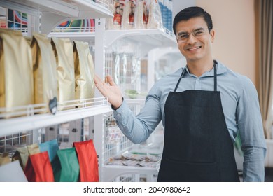 Entrepreneur Male Business Owner In Eyeglasses Working Selling Products In Convenience Store