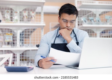 Entrepreneur Male Business Owner In Eyeglasses Using Computer Laptop Working In Grocery Shop Store