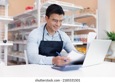 Entrepreneur Male Business Owner In Eyeglasses Using Computer Laptop Working In Grocery Shop Store