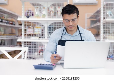 Entrepreneur Male Business Owner In Eyeglasses Using Computer Laptop Working In Grocery Shop Store