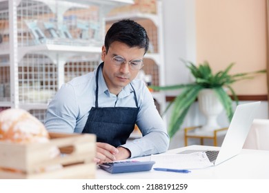 Entrepreneur Male Business Owner In Eyeglasses Using Computer Laptop Working In Grocery Shop Store