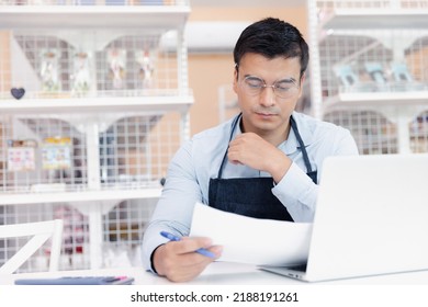 Entrepreneur Male Business Owner In Eyeglasses Using Computer Laptop Working In Grocery Shop Store