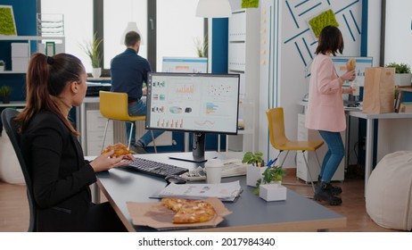 Entrepreneur Woman Having Meal Break Sitting At Table Eating Pizza Slice Fastfood Delivery. Takeaway Delivery Lunch Order Package Delivered At Company Office. Takeout Food At Lunchtime Eating At Desk