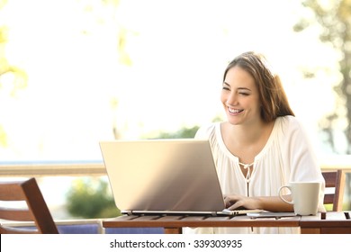 Entrepreneur Woman Working With A Laptop In A Coffee Shop Or Home Terrace 