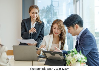 Entrepreneurs And Business People Conference In Modern Meeting Room, Happy Multiracial Coworkers Have Fun Cooperating Working Together At Office Meeting, Asian Teamwork Concept