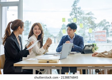 Entrepreneurs And Business People Conference In Modern Meeting Room, Happy Multiracial Coworkers Have Fun Cooperating Working Together At Office Meeting, Asian Teamwork Concept