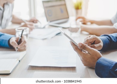 entrepreneurship new business start up meeting. Close up hand of young asian businessman taking note to notebook in the conference meeting for giving advice to new entrepreneurs. - Powered by Shutterstock