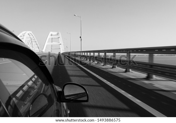 Entry to the\
Crimean bridge by car, view of the Crimean bridge from the window\
of a moving car in the summer\
morning