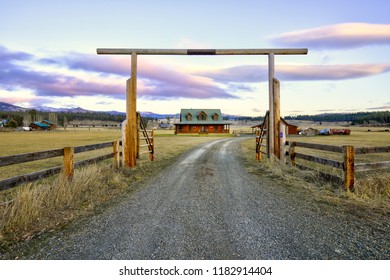 Entry Gate To A Nice Wooden Ranch Home With Beautiful Landscape. Northwest, USA.