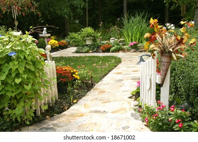 Entry into an amazing backyard filled with fall flowers