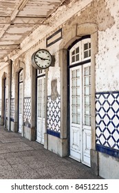 Entry of old train station with a clock