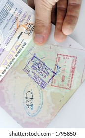 entry stamps and visa in a uk passport - Shutterstock ID 1795850