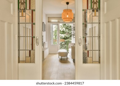 an entry way leading to the living room and dining area with mirrors on either side by side, as seen from the front door - Shutterstock ID 2384459817