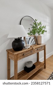 an entryway table with plants  - Shutterstock ID 2358127571