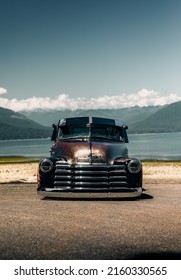 Enumclaw, WA, USA
April 5, 2022
Vintage Chevy Truck With Patina Parked In Front Of A Lake