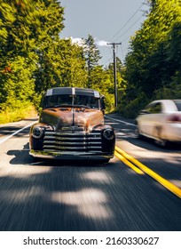 Enumclaw, WA, USA
April 5, 2022
Vintage Chevy Truck With Patina Driving On A Road 