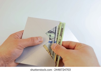 Envelope with dollars. Improper remuneration. Bribery.