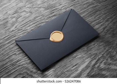envelope with stamp on the wooden table