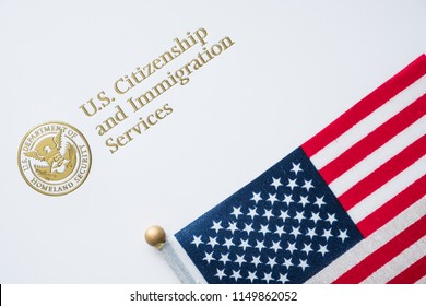 Envelope From U.S. Citizenship And Immigration Services With The American Flag On Top/U.S. Immigration Concept