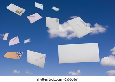 Envelopes Flying Against The Blue Sky And Clouds