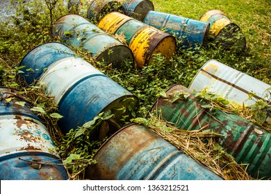 Enviromental Pollution With Old Rusty Stained Empty Oil Barrels Waste. Destroying Plannet With Land Nature Environment Pollution.