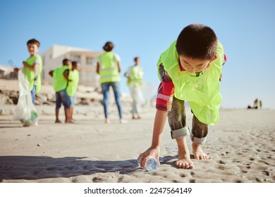 Environment, cleaning and children with plastic on beach for clean up dirt, pollution and eco friendly volunteer. Sustainability, recycle and kids reduce waste, pick up trash and bottle on beach sand - Powered by Shutterstock